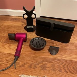 Pink and gray Dyson Hair Dryer plus case and stand